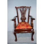 A reproduction mahogany child's chair