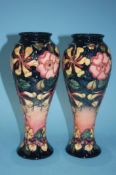 A pair of tall modern Moorcroft vases, impressed 'Moorcroft', 27cm high