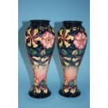 A pair of tall modern Moorcroft vases, impressed 'Moorcroft', 27cm high