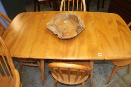 An Ercol drop leaf table and six Ercol hoop back c