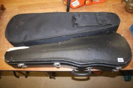 Two cased violins