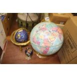 Three globe atlases on stands