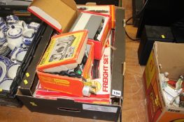 A box of Hornby electric train sets and accessories