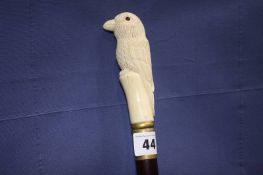 Walking cane with carved handle