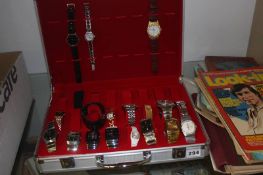 Collection of various wristwatches and a watch carry case.