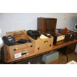 A large quantity of cameras and accessories and three radio sets