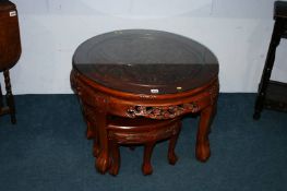 An Oriental style circular nest of tables