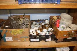 A shelf of china and glass