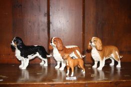 Three Beswick King Charles Spaniels etc.