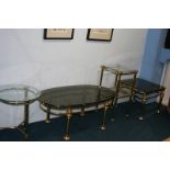 Four brass and glass occasional tables