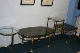 Four brass and glass occasional tables