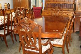 A reproduction extending dining table and six chairs (2+4)