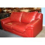 Red leather two seater sofa