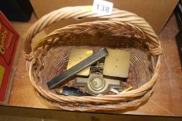 A wicker basket, including scales and clay pipe