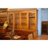 A glazed yew wood display cabinet