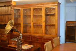 A glazed yew wood display cabinet