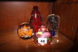 Four glass paperweights