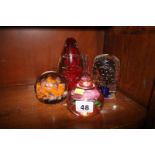 Four glass paperweights