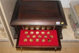 Cabinet containing various collection medallions