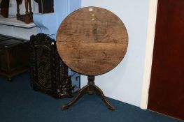 A Georgian oak tripod table