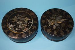 A pair of mother of pearl inlaid boxes. 20cm diameter