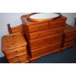 A Ducal pine chest of drawers, headboard, pair of bedside chests and mirror