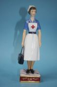 A Royal Worcester figure 'British Red Cross Society VAD member', no. 141/750, boxed, with