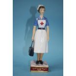 A Royal Worcester figure 'British Red Cross Society VAD member', no. 141/750, boxed, with