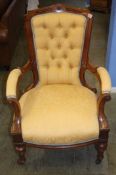 A Victorian walnut open armchair