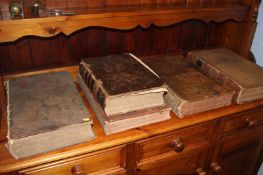 Five large leather bound Bibles