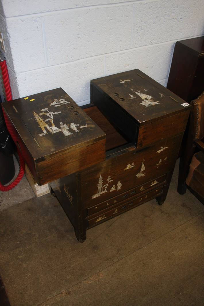 An Oriental hardwood work box, inlaid with mother of pearl