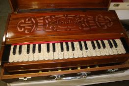 A table top Pump organ and case
