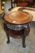 An Oriental carved hardwood plant stand, 63cm tall
