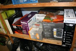 A shelf of boxed miscellaneous, digital glass panel heater etc.
