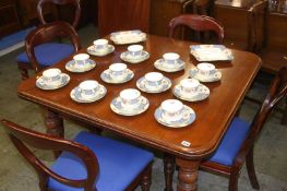 A mahogany wind out dining table and leaf and five balloon back dining chairs