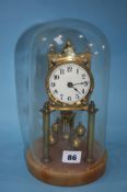 A German made anniversary clock under a glass dome