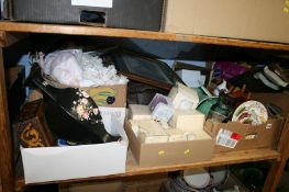 A shelf of miscellaneous including wristwatches, dolls etc.