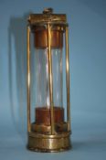 An early Usworth Washington brass, four bar miners lamp, maker T. Crake. 23cm height