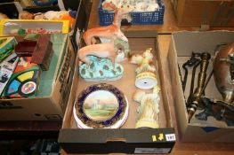 A box of decorative figures and plates