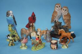 A collection of Royal Doulton, Beswick and other birds and animals (12)