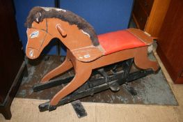 A wooden rocking horse