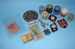 Tin of assorted German ephemera; patches and ribbons etc. to include Deutsche Seife, various rolls