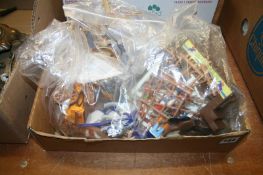 A box of Playmobil toys and accessories