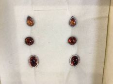 Three pairs of amber type earrings