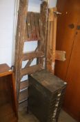 Step ladders, metal filing cabinet and an artists easel