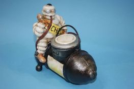 A Michelin Man sat on a compressor