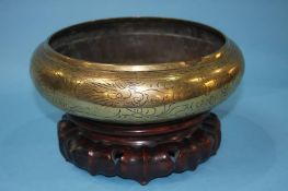 A Chinese shallow circular bowl and stand, 26cm wide