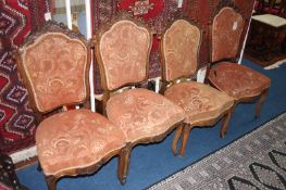 Set of four Victorian carved walnut chairs