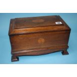 A mahogany box with rising lid, opening to reveal a secret drawer, decorated with marquetry and