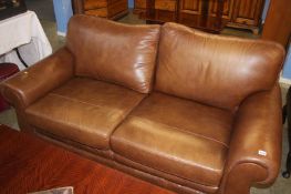A harvest brown leather two seater Laura Ashley sofa